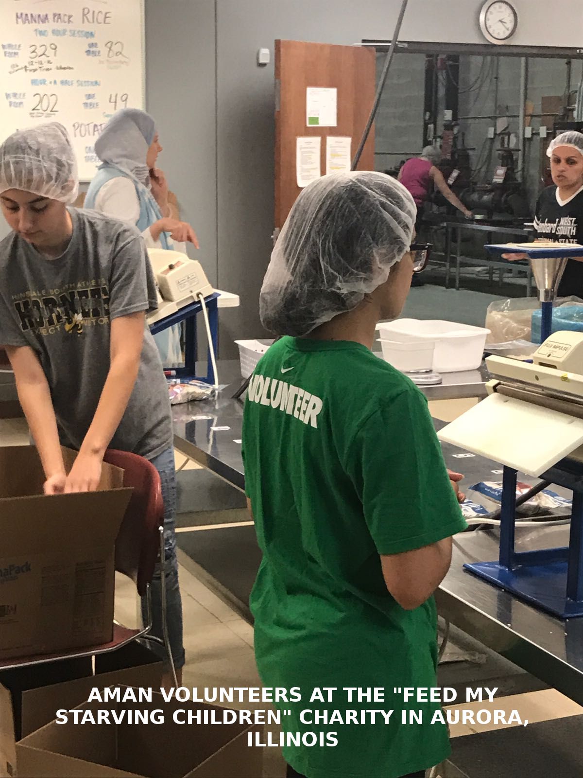 AMAN volunteer packing meals at Feed My Starving Children